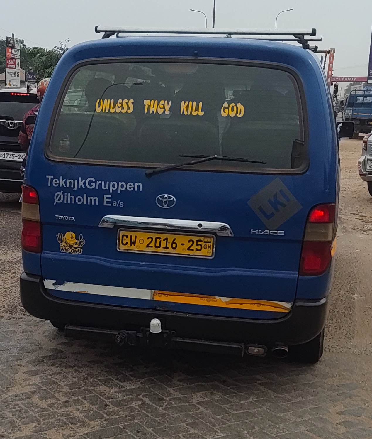 Religious/humorous/philosophical text inscriptions on the back windows of cars