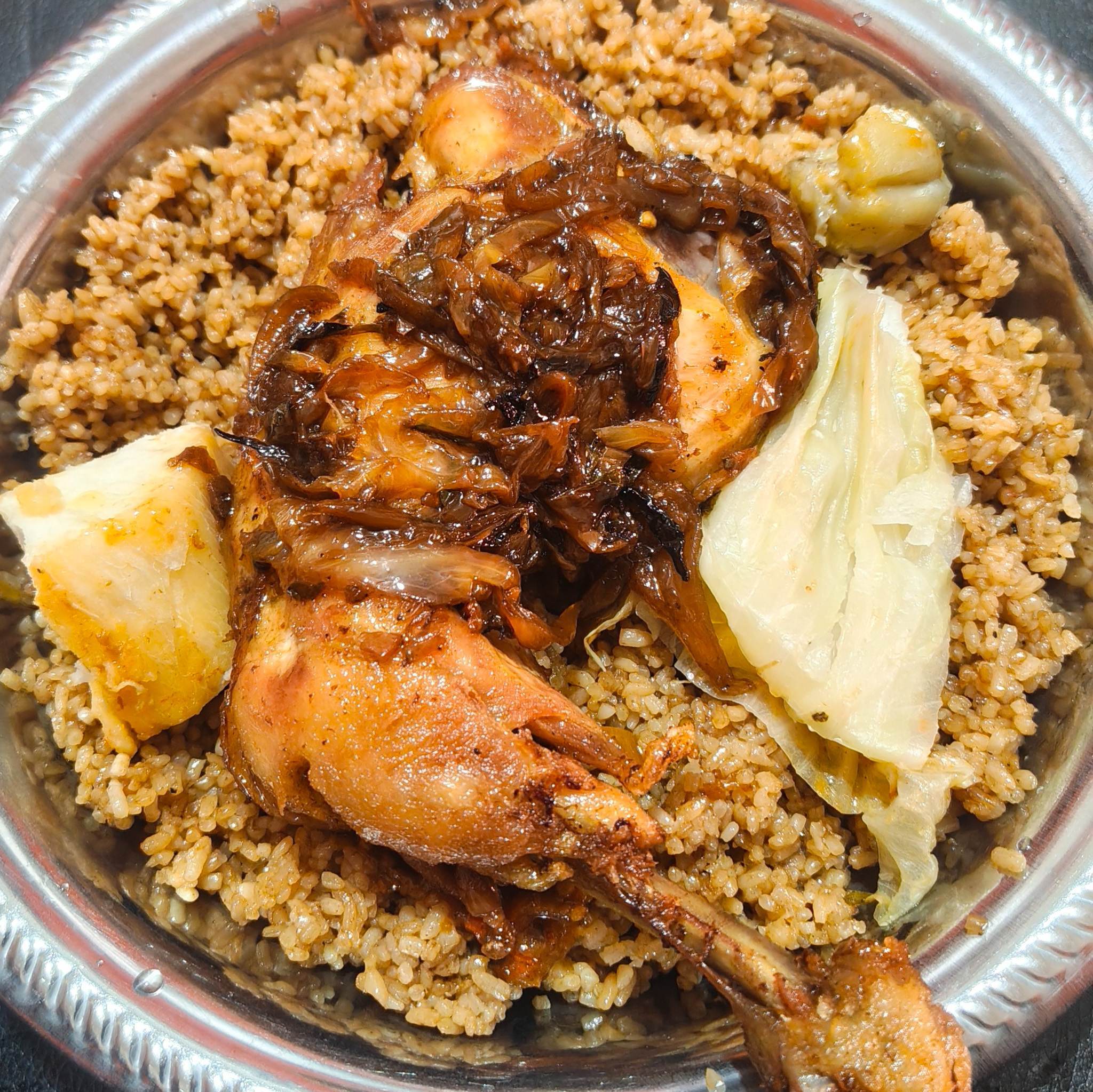 This rice and chicken was one of the best meals of my time in Guinea