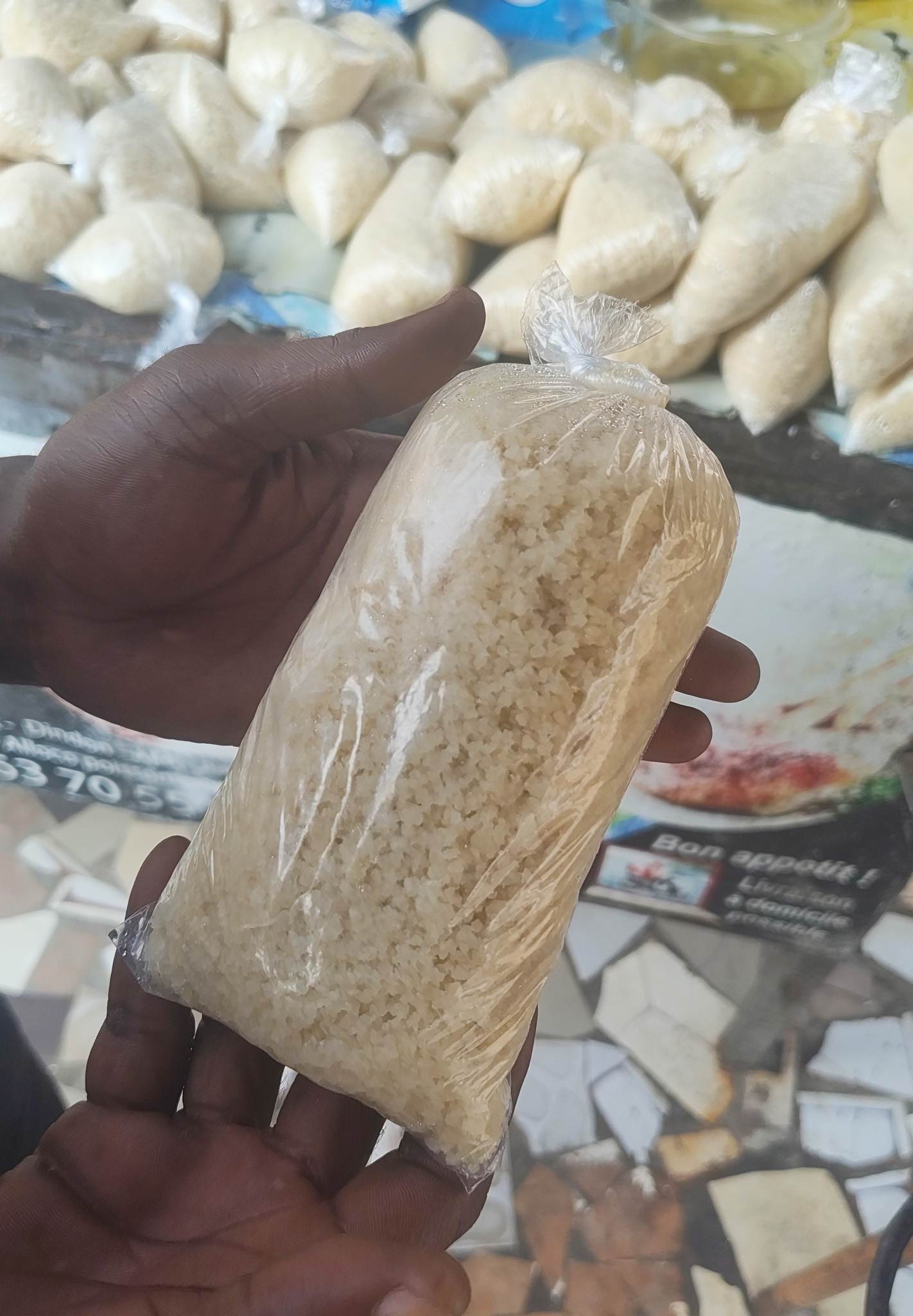 Choukouya (grilled spicy pork) with fried plantains and acheke