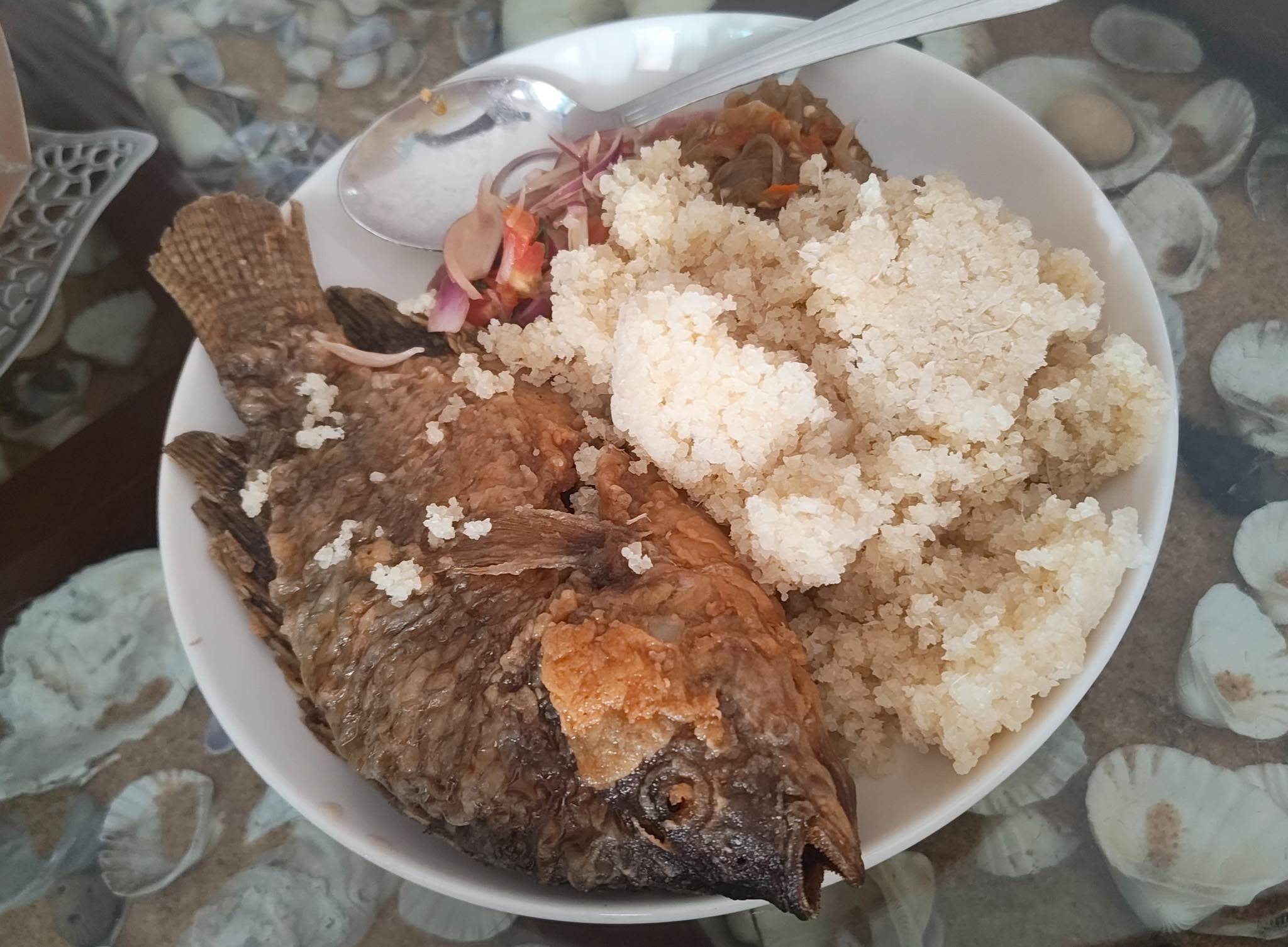 Acheke with fish and onions