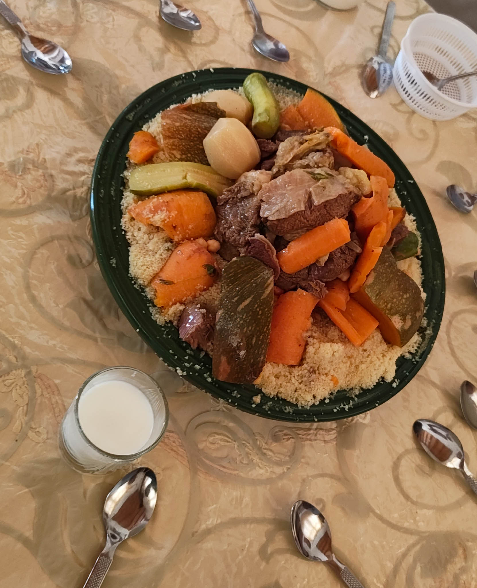 I was invited for lunch by a family who were from Casablanca but had a house in the mountains–they were Amazigh. The guy who invited me in actually lived in Astoria for a while! I enjoyed an amazing meal of couscous with them. We don't have individual plates, just ate from one big plate in the middle. Most people didn't end up using the spoons and just ate with their hands