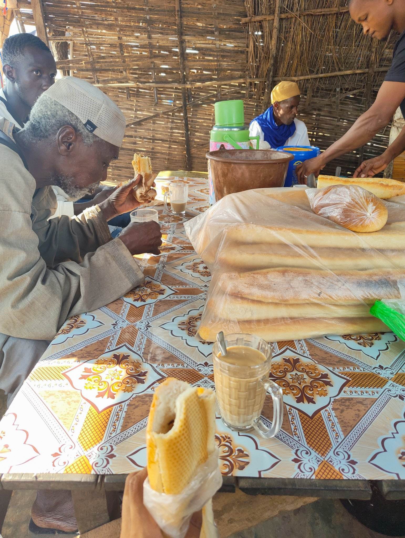 Common breakfast in Senegal: Coffee with condensed milk and a baguette with egg